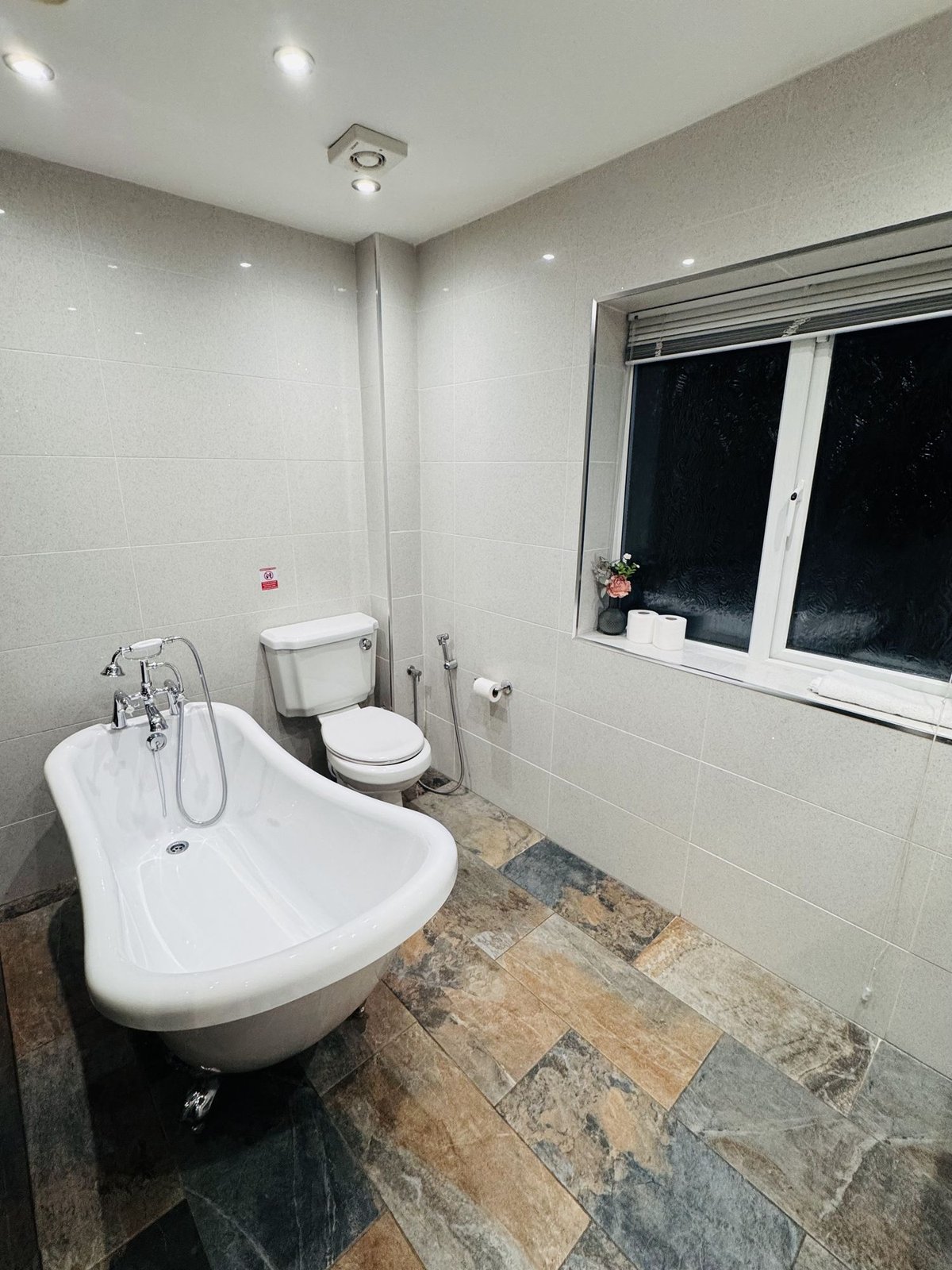 The Bungalow — bathroom with roll-top bath