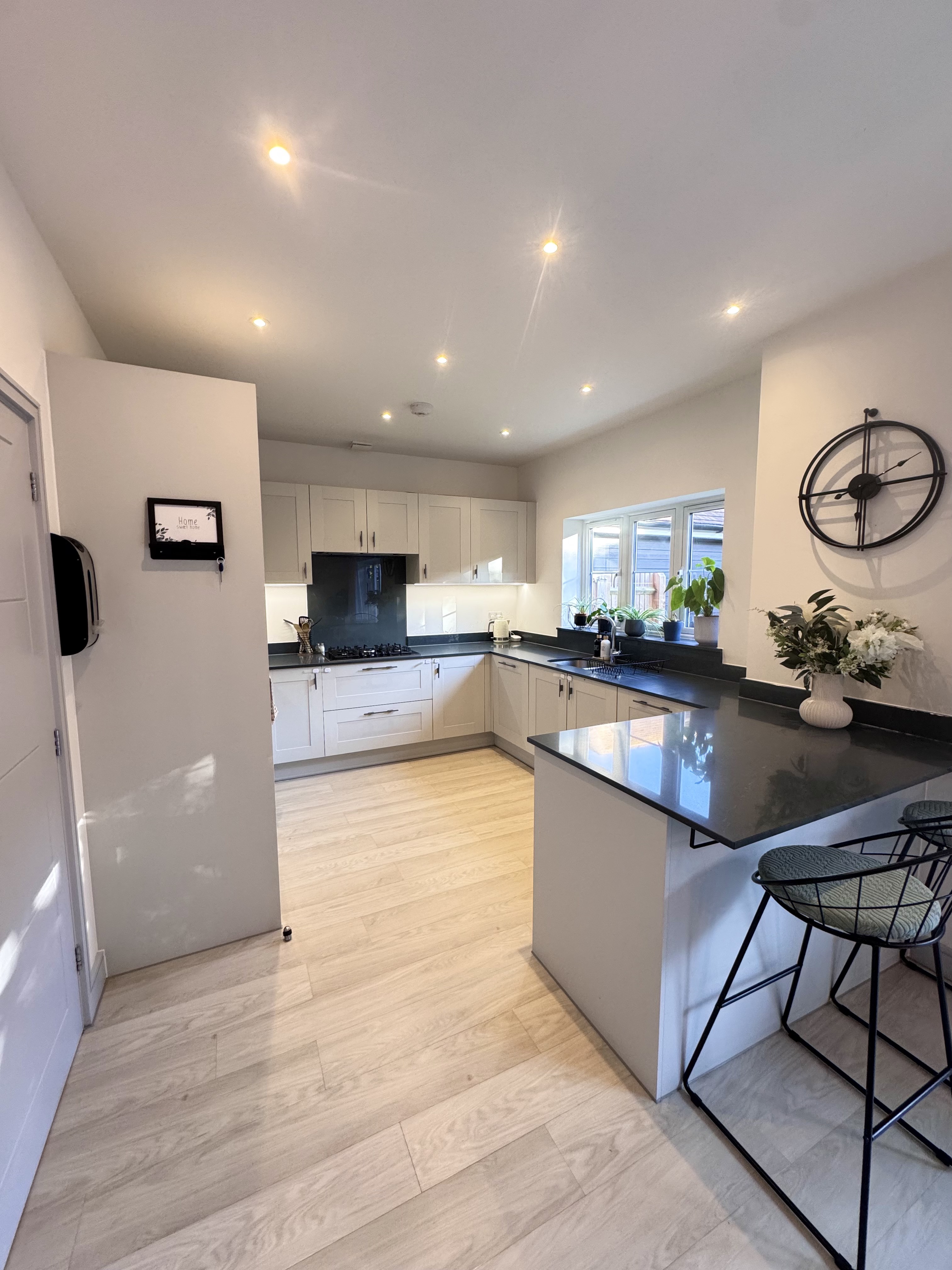 Modern kitchen with black granite worktops